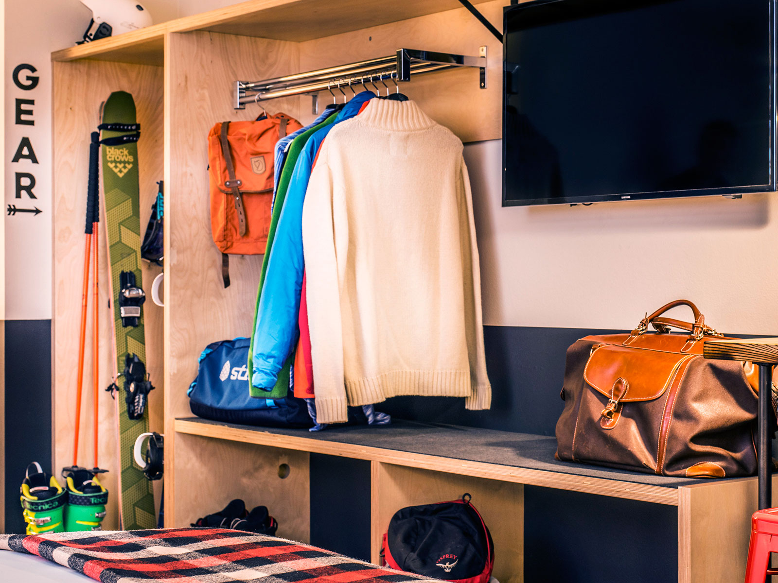 Mountain Modern Motel closet with hanging clothes and ski gear