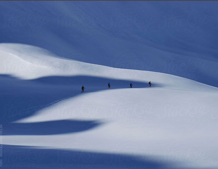 Four skiers doing backcountry skiing