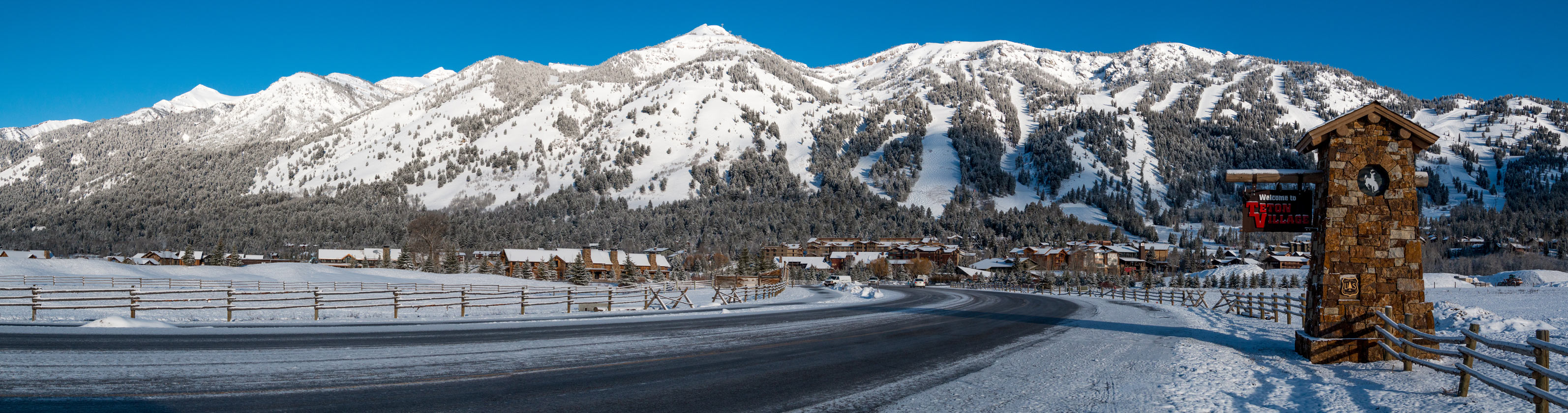 Highway view of Teton Mountain village in winter