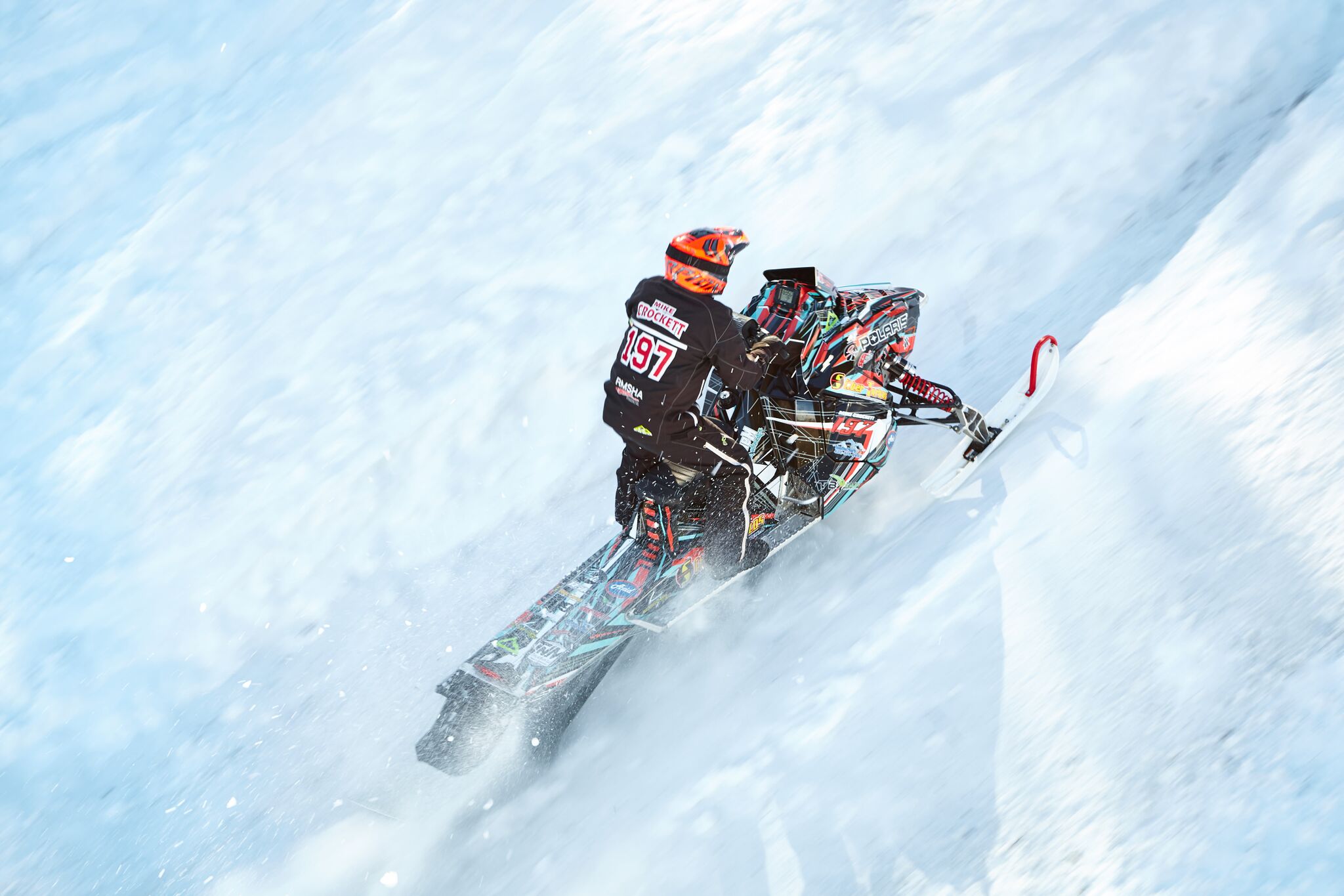 42nd Annual World Championship Snowmobile Hill Climb 2018 rider on snowmobile going uphill