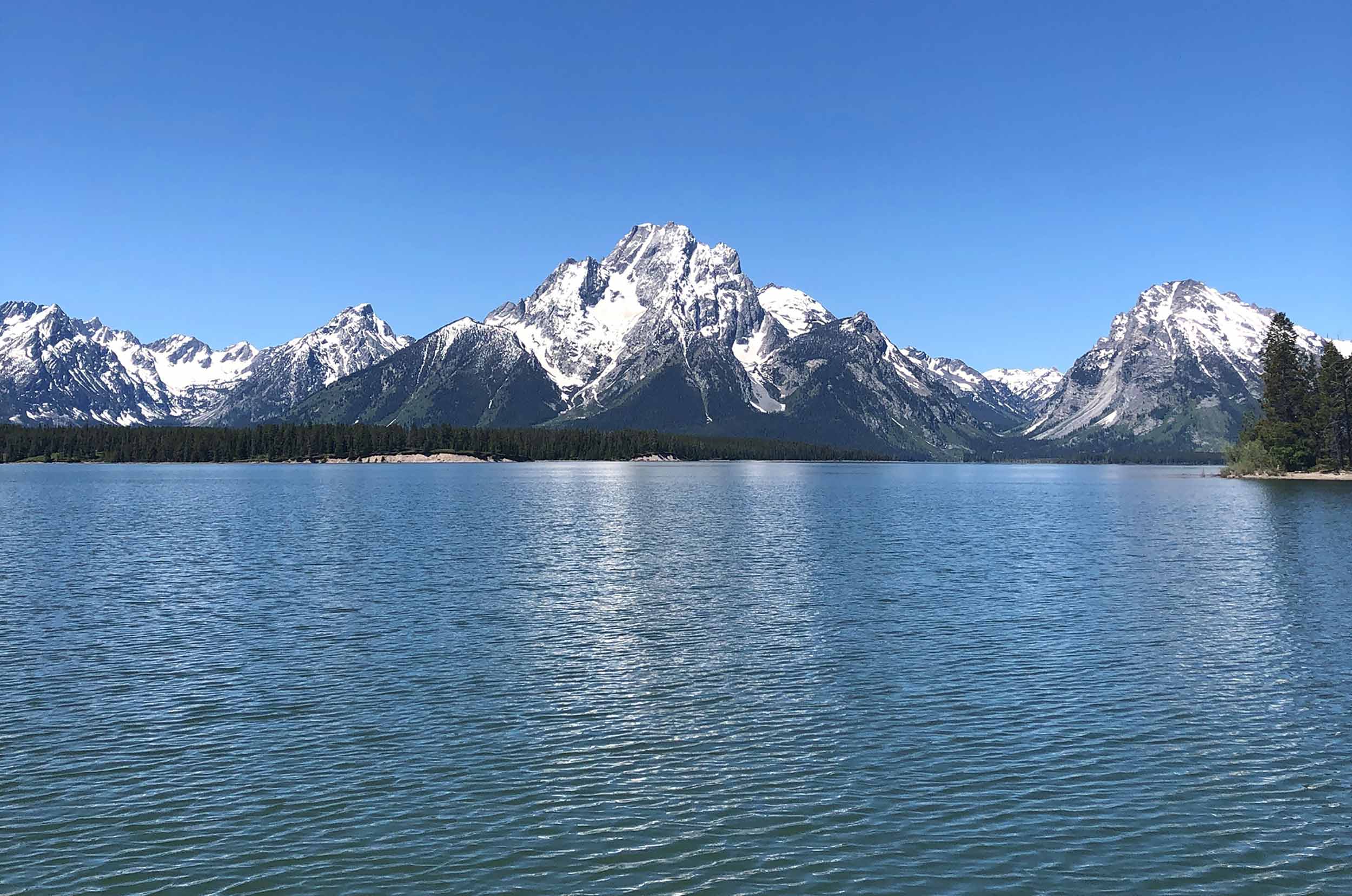 Jackson Lake Grand Teton National Park with snow capped Tetons in background