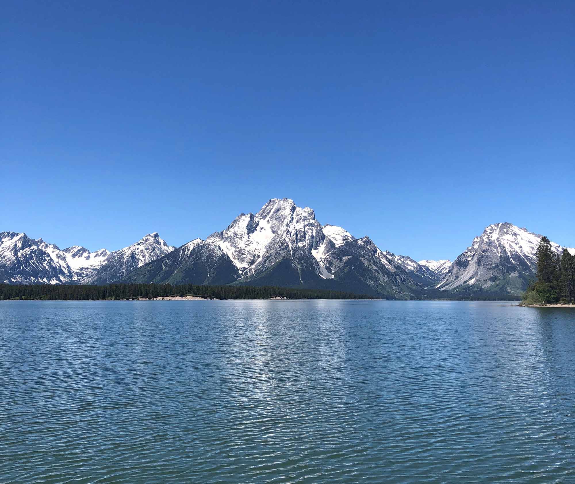 Jackson Lake Grand Teton National Park with snow capped Tetons in background
