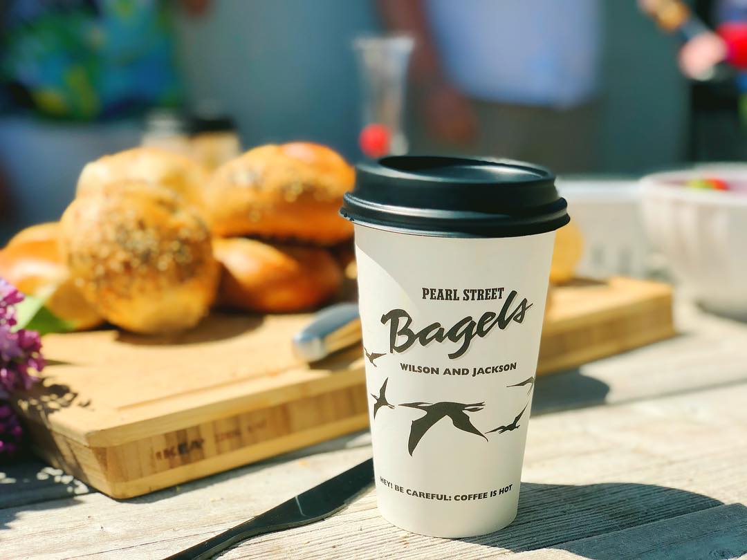 Pearl Street Bagels coffee cup with pastries