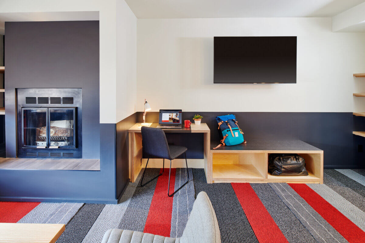 One Bedroom Two Queen Suite Living Room towards fireplace and desk