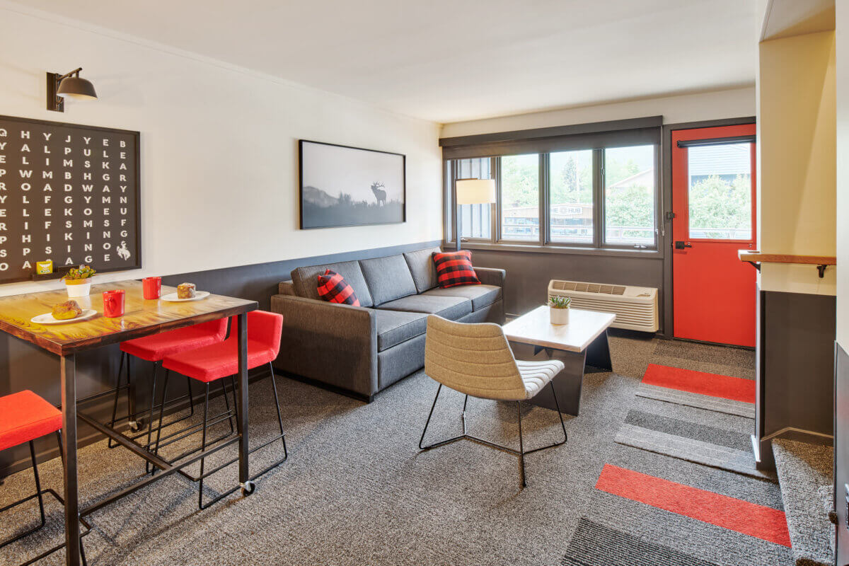 Two Bedroom Suite table and living room towards balcony coffee and pastries